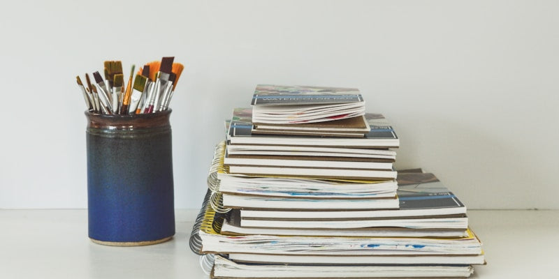 blue and white books on white table